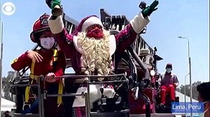 9.7K views · 241 reactions | WATCH: This Santa Claus ditched his sleigh and used a fire truck to hand out gifts to children with COVID-19 who are isolating at a facility in Peru. December 14th, a local fire brigade helped Santa reach more than 100 children through the windows of the treatment center. | KTVN 2 News | Facebook