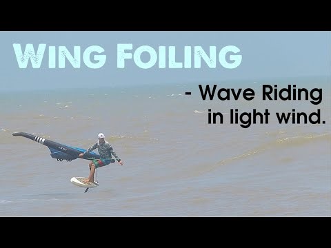 WING FOILING : Riding Waves in light side on shore wind.