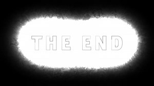 The End text with glowing white explosion on black background