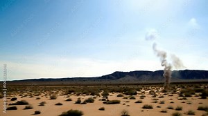 Footage of swirling dust devils dancing across a remote desert, twisting and spiraling with the wind, creating a dramatic natural spectacle.