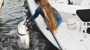 Surrounded by sharks while feeding tarpon by hand