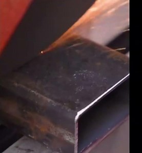 the process of cutting an iron rod using a special machine