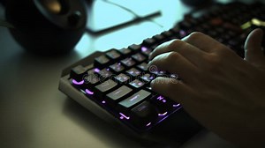 Young Gamer Plays a Video Game or Typing on Colorful Keyboard, Close Up. Clip Stock Photo - Image of electronic, concept: 298594546