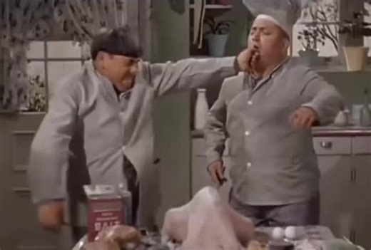 Flashback Rewind on Instagram: "📼 Flashback Rewind 1940s “Nyuk-nyuk-nyuk! Woo-woo-woo!” 😂🍗🎬 Few comedy moments hit the soul like Curly Howard in the kitchen — especially when he’s attempting to make a turkey dinner. Whether he’s stuffing the bird with everything but the stuffing, wrestling it like it’s alive, or seasoning it with half the spice rack, Curly turned chaos into pure art. 🍗🤣🔥 His childlike charm, wild energy, and perfect timing made even the simplest kitchen scene explode into