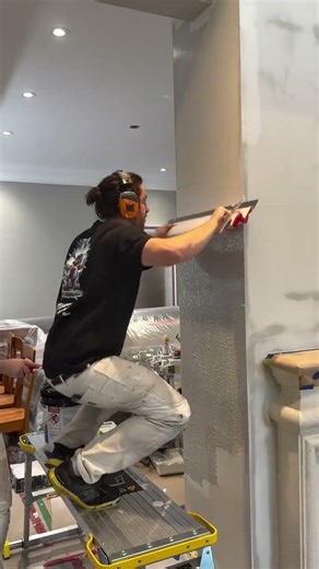 Skimming out this fireplace to get a perfectly even surface.