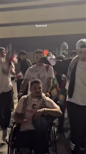 Ryad Aref on Instagram: "A wounded Palestinian fan, whose leg was severely injured in Gaza, celebrated from his wheelchair as he left the stadium in Qatar — surrounded by cheering supporters — after Palestine’s dramatic 1–0 win over Qatar. A moment of victory… even with the pain"