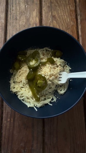 My lunch and supper today spaghetti (plain) with season on it, Parmesan cheese and jalapeños !!