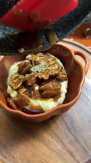 🍁Maple Pecan Baked Brie 🍁 Try this variation of baked brie for an easy holiday appetizer or cozy afternoon snack! Shop fall cookware: http://bit.ly/487Xu4v Ingredients: 8 oz brie cheese wheel 1/3 cup maple syrup 1/4 cup brown sugar 1 tsp of cinnamon 1/3 cup pecans Fresh thyme to garnish Directions: Heat oven to 400 degrees fahrenheit. Score the top of the brie cheese and add it to a ceramic dish. Bake in the oven for 12-15 minutes. While it bakes, heat a pan to medium and add brown sugar, cinn