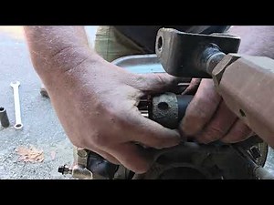 Removing metal sleeved rubber bushing from knuckle assembly 2002-2006