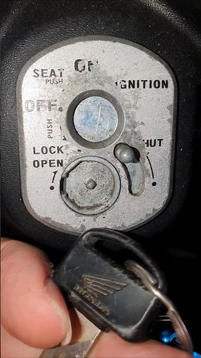 How do I open this keyhole cover?