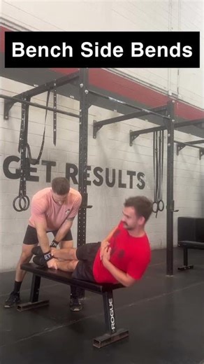 On bench with partner holding legs perform side bends coming up as high as possible