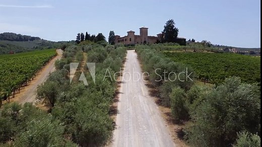 Tuscan landscape. panoramic aerial view with drone of the beautiful medieval castle and cellar of Castello di Gabbiano and its vineyards