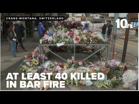 Sparkling candles atop wine bottles may be to blame in Swiss bar fire