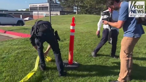 Police tape off the crime scene where Charlie Kirk was shot