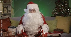 Santa Claus watching an engaging football match