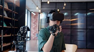 4K, Asian boy wearing a 3D ride around his eyes on head and have headphones attached player listen sound, wore a robot hand controller It is a hand robot intended for assisting disabled.