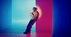 Rema searches for a dance partner in the “Charm” video