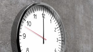 Classic clock on conrete wall - 12 o clock