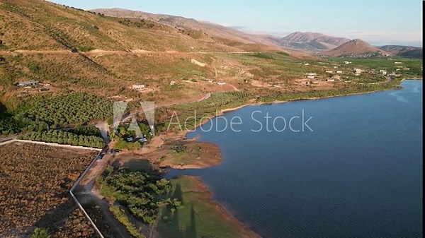 Small private camping site next to a restaurant in the village and lake Mursi close to Ksamil or Xarre in southern Albania. Campervans, Motorhomes and RV are camping next to a restaurant.