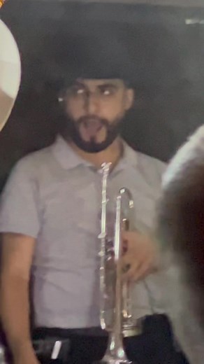 Trombone Performance in Purple Lighting