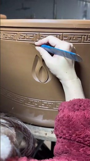 Traditional Pottery Carving: Hand-Carved Clay Decoration