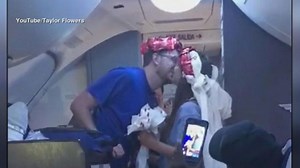 Newlyweds get midair wedding ceremony on flight to honeymoon