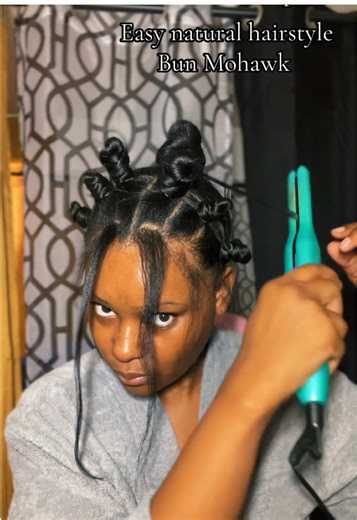 Bun Mohawk Super easy natural hair style I’m taking this style down at the end of the day so i didn’t use any product or care about super straight parts