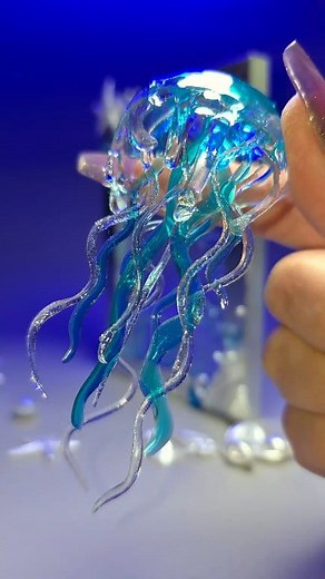 It’s not just a frame — it’s a world where a glowing jellyfish floats through calm resin waves. A piece of ocean light captured forever. #fblifestyle #resinart #resindecor #uvresin #handmade #blueaesthetic #creativevibes #oceaninspired #resinartist | Ольга Журавлева