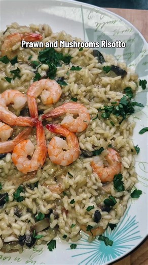 Prawn and Mushrooms Risotto Ingredients: - 50gr king prawns - 150gr Arborio risotto rice - 1 large sliced flat mushroom - 1 small diced onion - 0.5 ltr chicken stock - 0.5 ltr booking water - 1 table sp grated parmesan - 1/2 tea sp garlic powder - grated parmigiano reggiano - 2 table sp olive oil - a knob of butter - a squeeze of lemon Method: Sautee your prawns in a bit of olive oil and butter, 2 minutes each side, then remove and put aside. Sautée your onions in the same pan for a couple of mi
