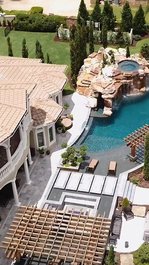 This pool is 110 feet long, 100 thousand gallons, 168 tons of rock, and has a 140 foot long water slide. #insanepools #lucaslagoons #pool #poolparty #poolbuilders #backyard #insane #waterslide | Lucas Lagoons