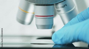 Science and technology. Tests. Medical experiment. Using a high-tech microscope, scientists examine the sample in a modern industrial laboratory.