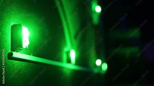 Green LED lights illuminating a dark wall, creating a stylish ambient lighting effect