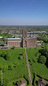Drone aerial footage of spinning around of Guildford Cathedral and the city. Guildford Cathedral is the Anglican cathedral in Guildford, Surrey, England.