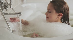 Little girl taking a sparkling bath - Free Stock Video