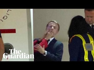 Moment Macron's wife pushed him in the face as they land in Vietnam