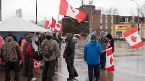 Massive trucker protest blocks major border crossing between US, Canada
