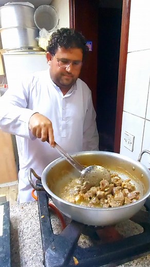 Methodical Stew Preparation in a Chef's Kitchen