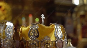 Wedding crowns. The wedding in the Church. Marriage ceremony in a Christian Church. The priest, the bride and groom inside