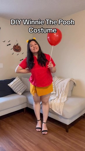 DIY Winnie The Pooh Costume! Loved putting this costume together with what I had at home! I bought the yellow pom poms and red balloons from the dollar store 🎈 Such a great costume to throw together when you need something last minute! 🍯#halloweencostume #halloweencostumeideas #diycostumes #winniethepooh #winniethepoohcostume #lastminutecostumes #costumeshalloween #costumeideas