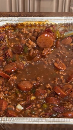 You have to try these Smoked Cowboy Baked Beans 🤠🔥 We’re loading up @saucyspoonbeans Jalapeño & Bourbon baked beans and making the ultimate side dish. Recipe: In a foil pan or large baking dish combine the following: 2 cans of Saucy Spoon Jalapeño and Bourbon baked beans 1 pound ground Italian or breakfast sausage (cooked) 1 package of bacon (cooked) 12 oz kielbasa sausage 1 onion, diced 1 green bell pepper, diced 1 tablespoon hot sauce 2 tablespoons Worcestershire sauce 2 tablespoons yellow m