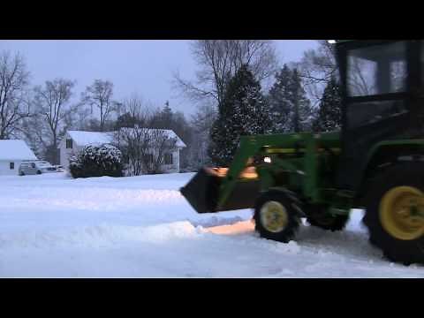 Plowing snow with the John Deere 790 Compact Tractor with Original Tractor Cab
