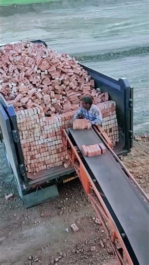 Transporting bricks into trucks automatically with machines