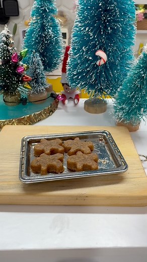 How to make miniature Gingerbread Cookies : recipe dark soft brown sugar, golden syrup, baking powder, lil egg, plain flour, butter, ginger, cinnamon - How to make- melt the butter, golden syrup and sugar until melted, once cooled add them to the dried ingredients and egg and mix until dough. Roll out the dough into baking paper and refrigerate until cold. Get your lil ginger bread man cutter and cut out, te tilling the dough until it’s all made into tiny l gingerbread man and ladies. If you wan