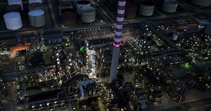 Industrial factory polluting carbon dioxide emission of fossil fuels affecting climate change