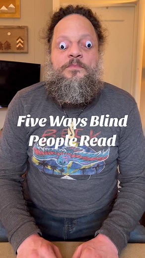Here are some accessible ways that blind people read! Most people think of braille, but not all people who are blind can read braille. There are many other avenues that make books available to everyone. #accessibility video description: John starts the video wearing googly eyes. Then he is shown just as he is. He is blind with his eyes closed. He’s shown reading braille with his fingers, then holding a smart phone over a book. Then he is shown wearing an #orcam device. He holds a magnifying glas
