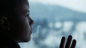 Boy behind the window  - Free Stock Video