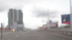 Blur texture background for design. Street view from the car window in rainy weather