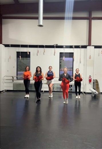 Exciting Dance Routine with Cheer Poms and Sports Cars