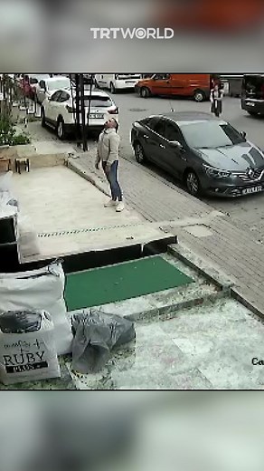 A man caught a cat falling from the third floor of a building in Istanbul, Türkiye. He noticed the cat was walking on the windowsill and ran to save it. | TRT World