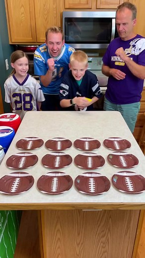 Touchdown Toss - Football party game 🏈 Family plays funny football party game with mini bean bags and plates for fun football themed prizes. Toss a bean bag to score a touchdown and win a prize. Whoever lands on the golden plate, wins a special prize. #fblifestyle "🎬 This video was produced by Network Media and Benson Bros" | Play Together Stay Together